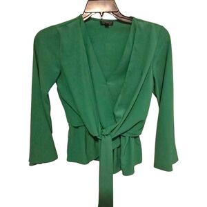 Topshop green wrap blouse featuring a v-neckline And Tie Waist